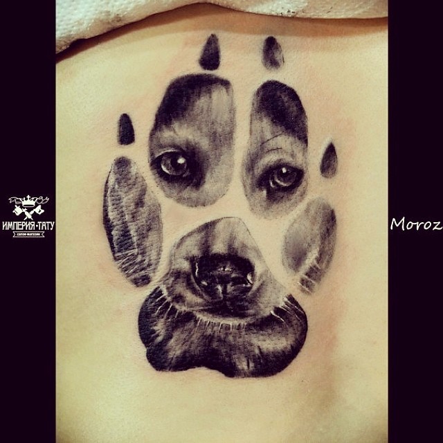 Unique Puppy face in paw tattoo by Moroz