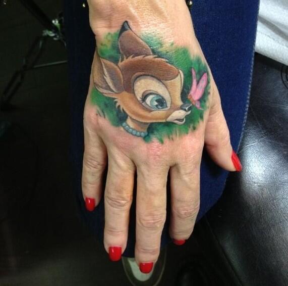 Amazing Bambi Head With Butterfly Tattoo On Girl Hand