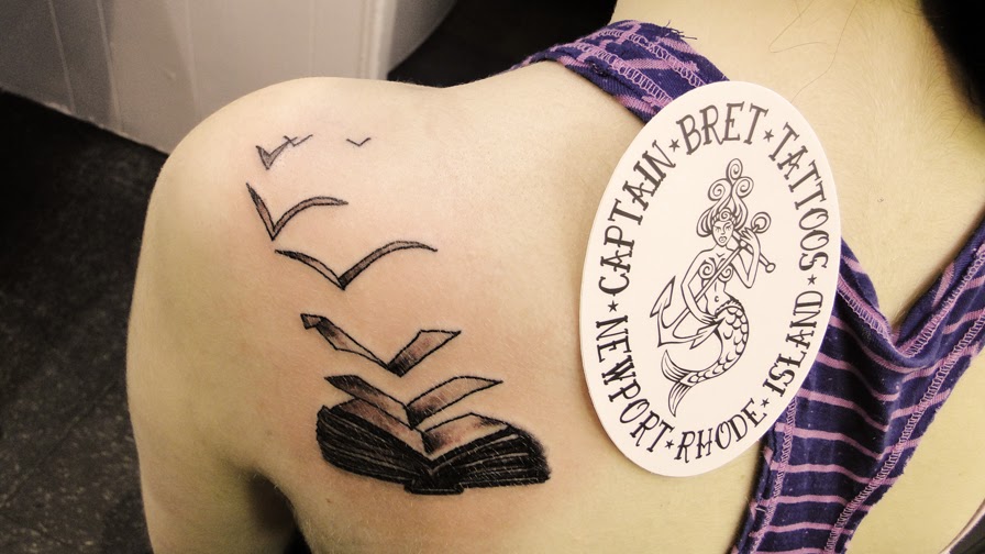 Amazing Black Ink Book Tattoo On Left Back Shoulder