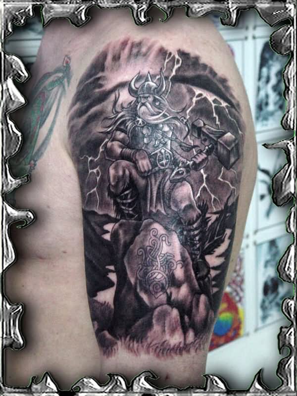 Amazing Black Ink Thor Tattoo On Man Left Shoulder By Mojotatboy