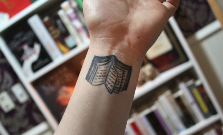 Amazing Black Open Book Tattoo On Wrist By Anon