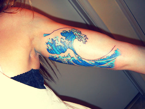 Amazing Blue Ink Wave Tattoo On Half Sleeve