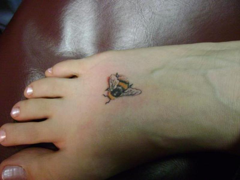 Amazing Bumblebee Tattoo On Girl Foot