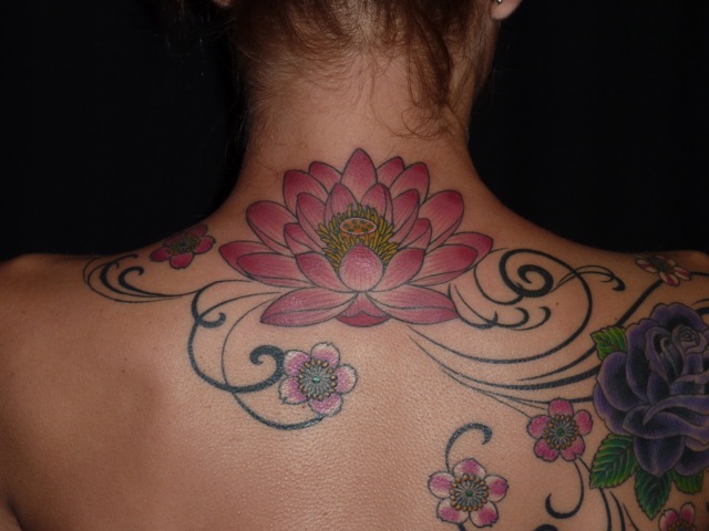 Amazing Colorful Nature Flowers Tattoo On Girl Upper Back