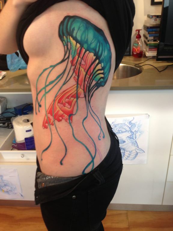 Amazing Colorful Nature Jelly Fish Tattoo On Girl Side Rib