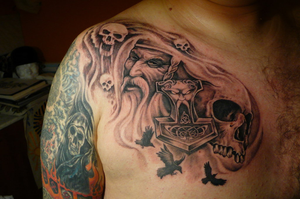 Amazing Thor Face With Skulls Tattoo On Man Right Front Shoulder