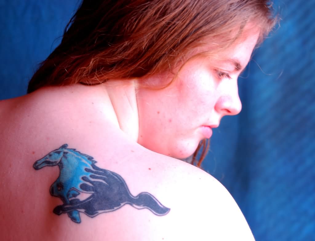 Awesome Blue And Black Mustang Tattoo On Girl Right Back Shoulder