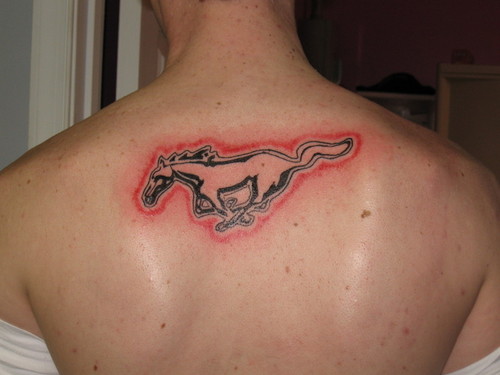 Awesome Red And Black Outline Mustang Tattoo On Man Upper Back