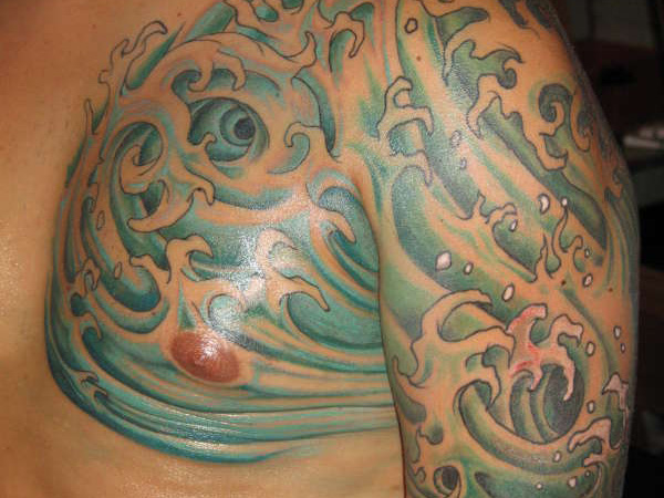 Awesome Water Wave Tattoo On Man Left Shoulder