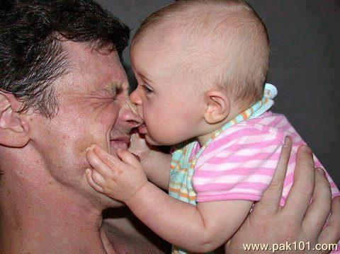 Baby Biting Father Nose Funny Picture