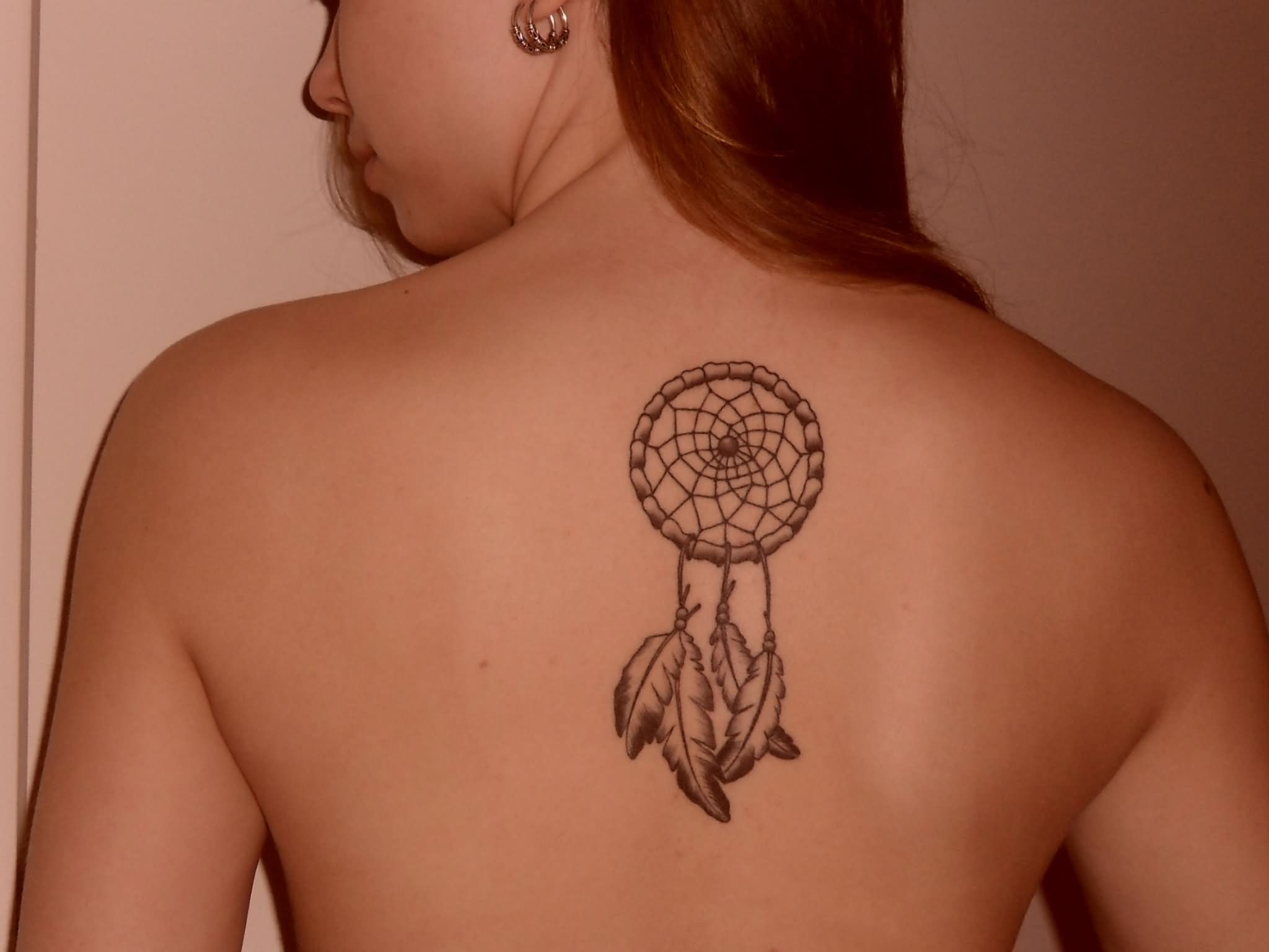 Black And Grey Dreamcatcher Tattoo On Back.