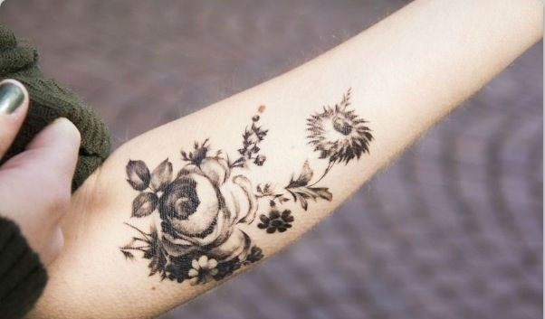 Black And Grey Nature Flowers Tattoo On Forearm