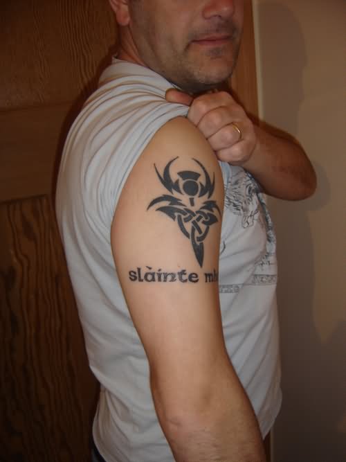 Black Celtic Thistle Flower Tattoo On Man Right Shoulder