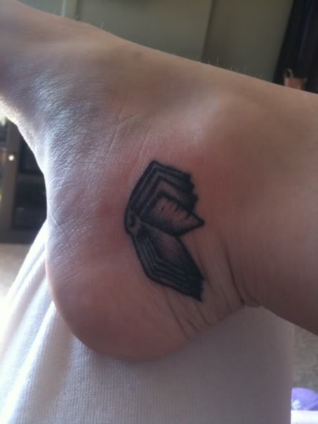 Black Ink Book Tattoo On Ankle