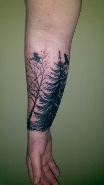 Black Ink Nature Scene Tattoo On Forearm