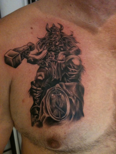 Black Ink Thor Tattoo On Man Chest