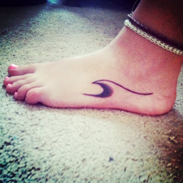Black Ink Wave Tattoo On Girl Foot