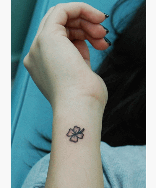 Black Little Four Leaf Tattoo On Side Wrist