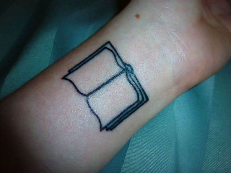 Black Open Book Tattoo On Wrist