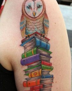Colorful Books With Owl Tattoo On Shoulder