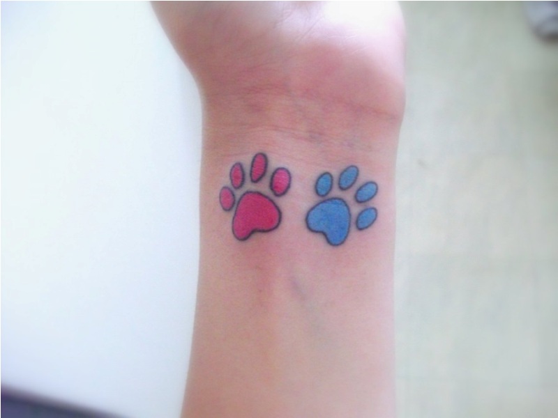 Colorful Dog Paw Tattoos On Left Wrist