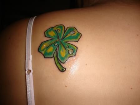 Green Flour Leaf Tattoo On Left Back Shoulder