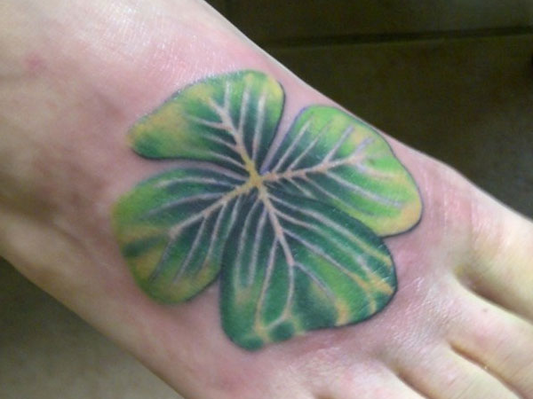 Green Four Leaf Clover Tattoo On Right Foot