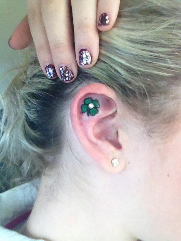 Green Four Leaf Tattoo On Inside The Ear