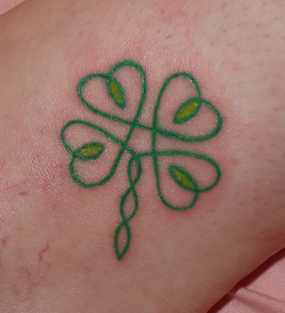 Green Ink Celtic Four Leaf Tattoo Design For Arm