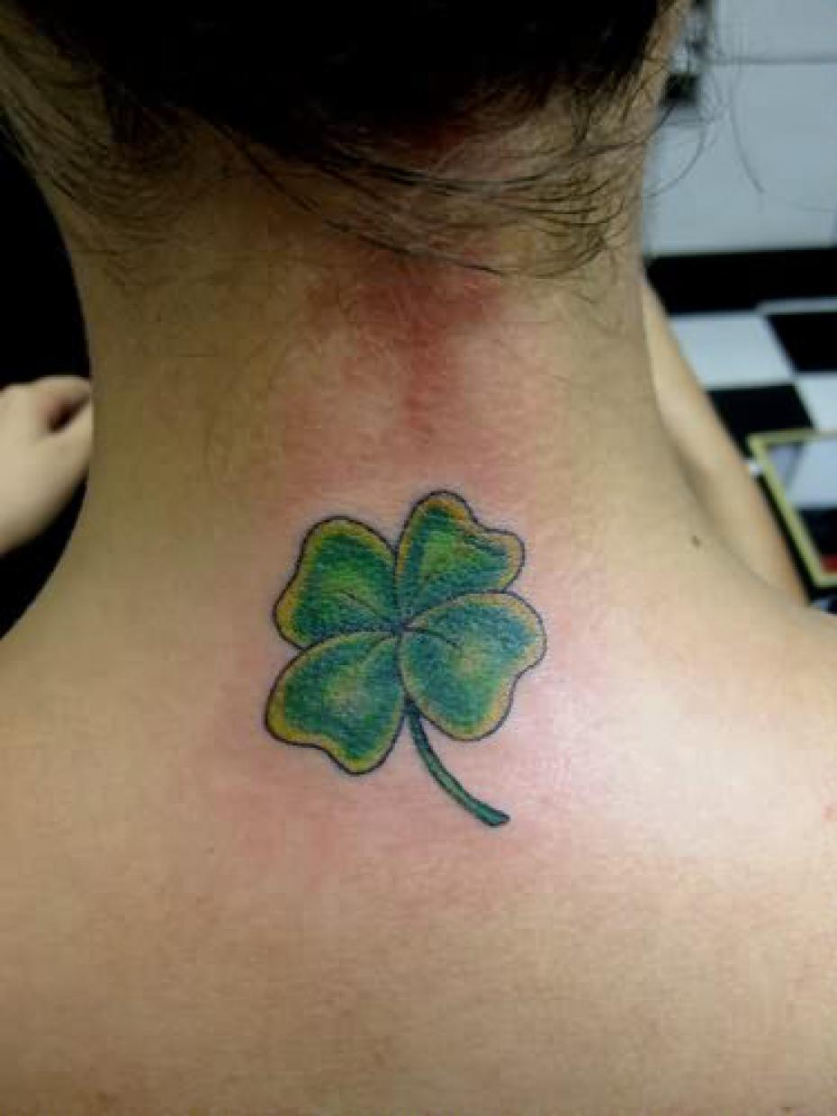 Green Ink Four Leaf Tattoo On Girl Back Neck