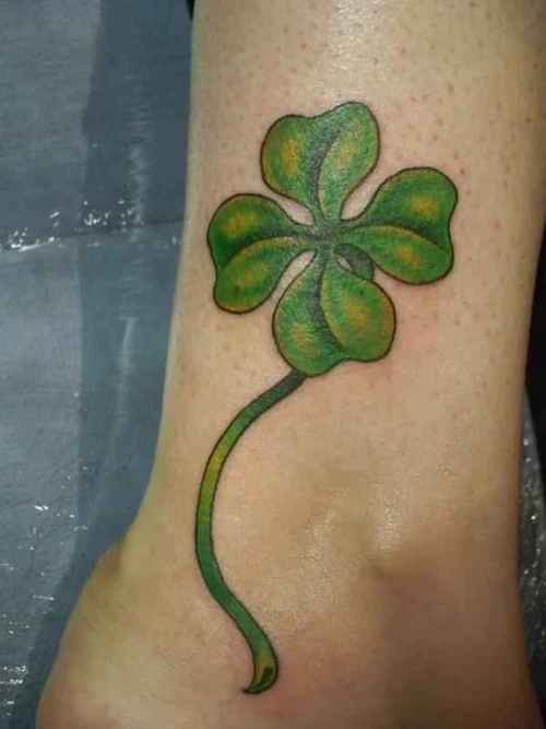Green Ink Four Leaf Tattoo On Leg
