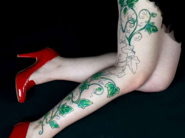 Green Vine Leaves Tattoo On Girl Right Leg.