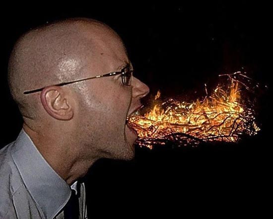 Man Blowing Fire Funny Unusual Angle Image