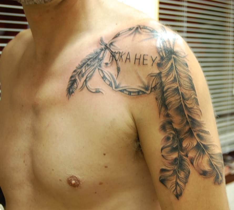 Man Showing His Dreamcatcher Tattoo On Left Shoulder