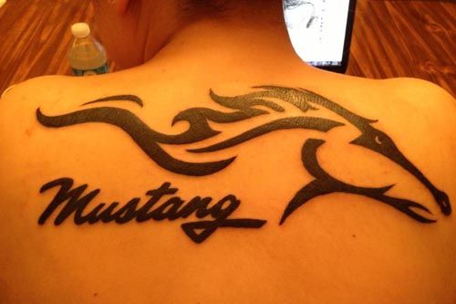 Mustang – Black Tribal Mustang Head Tattoo On Upper Back By Vince Steele