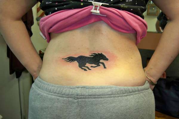 Silhouette Mustang Tattoo On Girl Lower Back