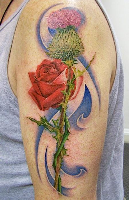 Thistle With Red Rose Tattoo On Man Left Shoulder