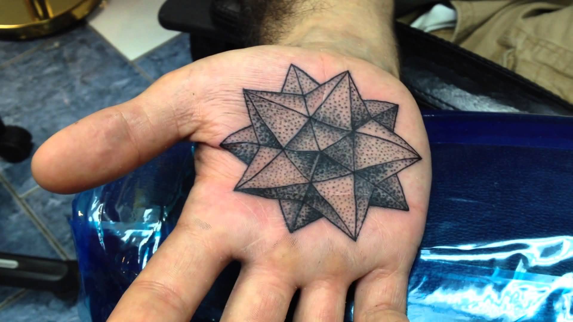 3D Black Ink Geometric Star Tattoo On Hand Palm