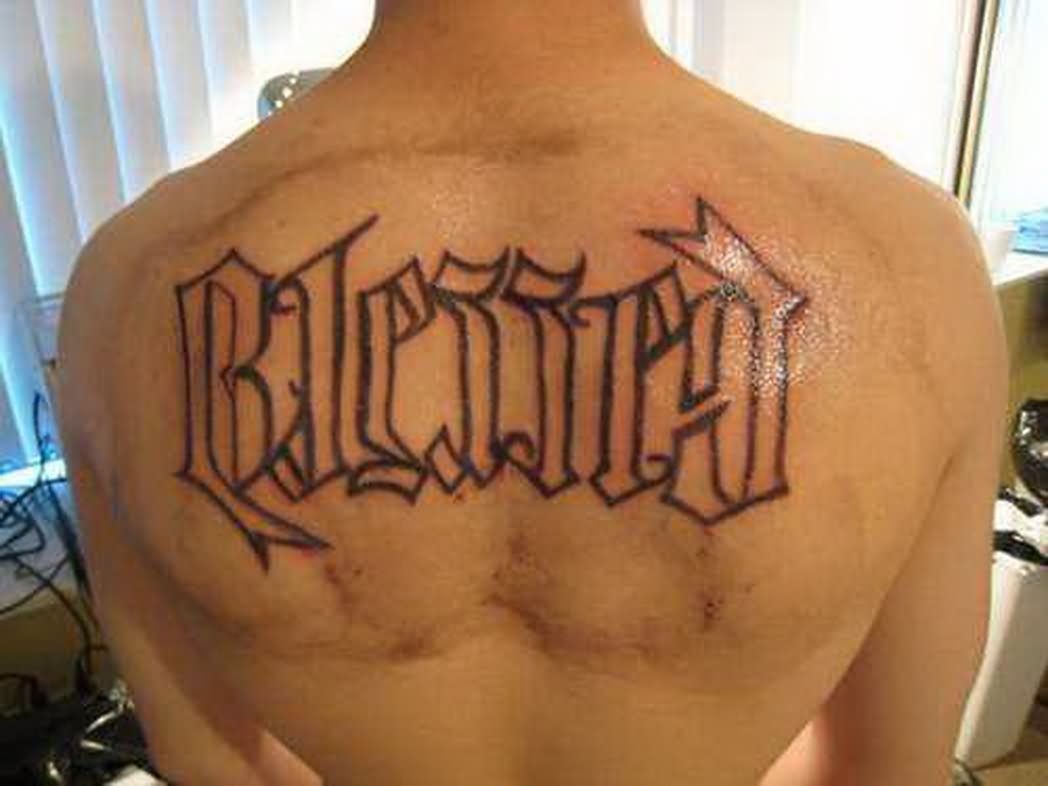 Amazing Ambigram Blessed Lettering Tattoo On Man Upper Back