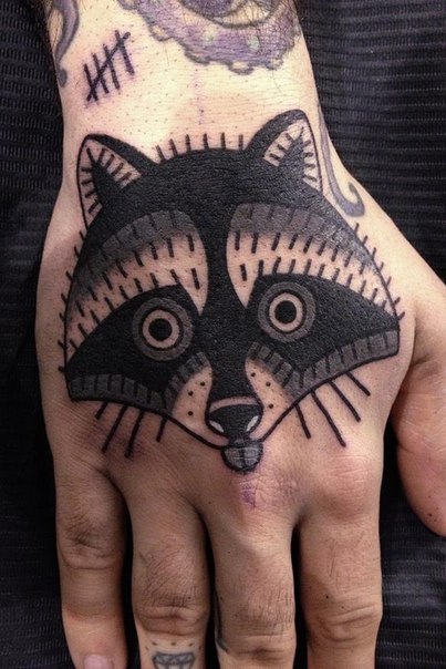 Amazing Black Ink Raccoon Head Tattoo On Hand