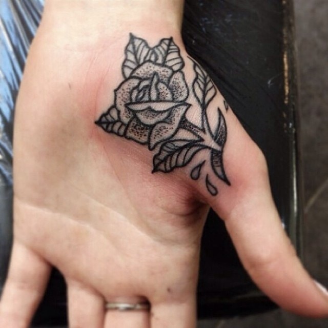 Amazing Black Ink Rose Tattoo On Hand Palm