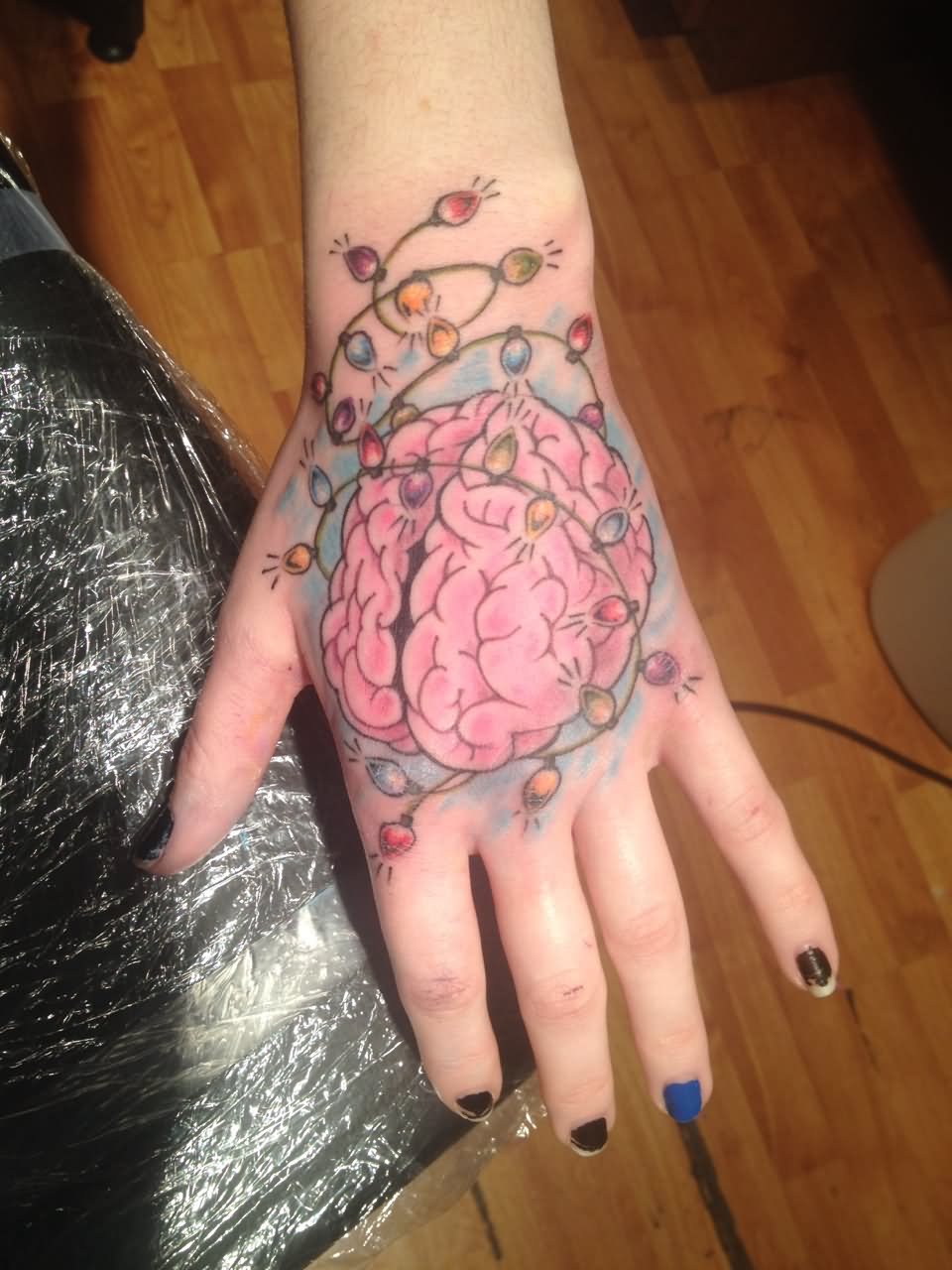 Amazing Brain Tattoo On Girl Hand