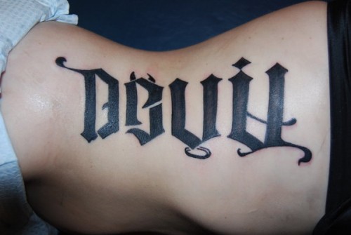 Ambigram Devil Lettering Tattoo On Side Rib
