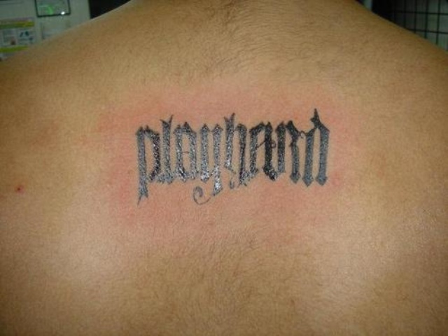 Ambigram Play Hard Lettering Tattoo On Man Upper Back