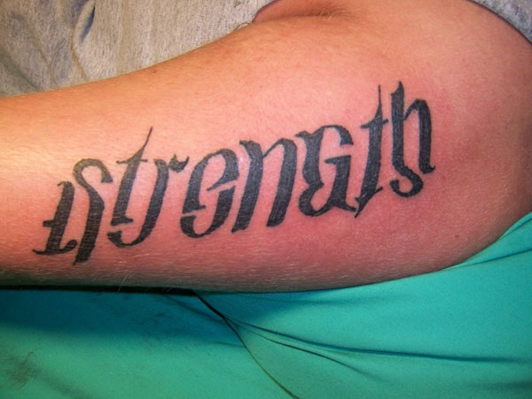 Ambigram Strength Lettering Tattoo Design For Arm