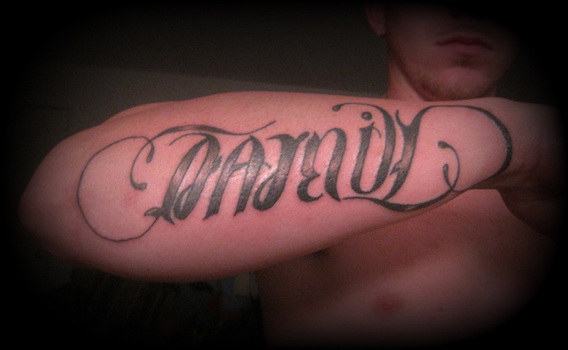 Ambigram Tattoo On Man Right Forearm