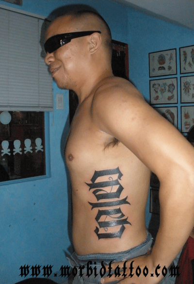 Ambigram Tattoo On Man Side Rib By luigi