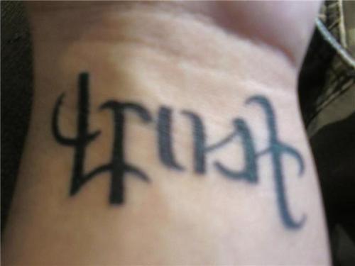 Ambigram Trust Truth Lettering Tattoo On Wrist