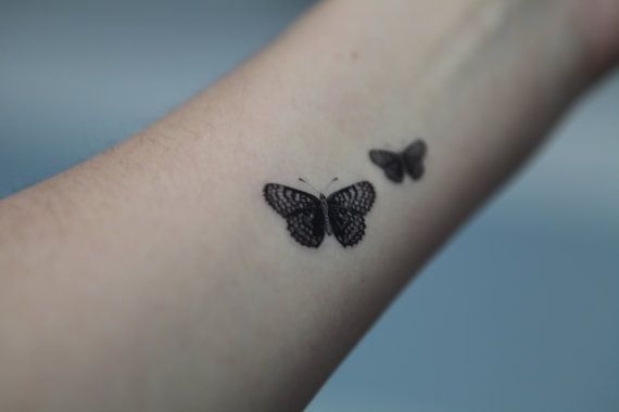 Black And Grey Butterfly Tattoo On Forearm