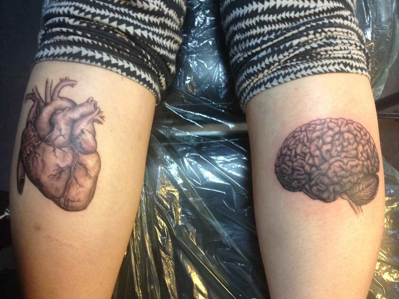 Black And Grey Real Heart And Brain Tattoo On Both Leg